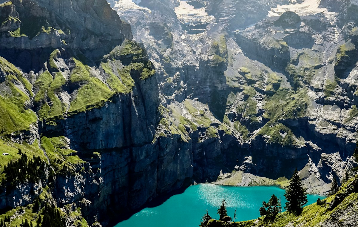 An alpine lake surrounded by green mountains